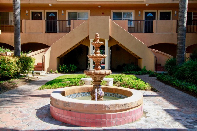 the fountain of a home with a line house with a cement fountain in villa del mar of california