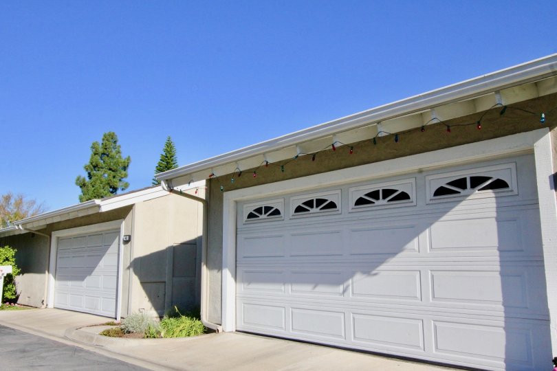 Two garage structures with large white garage doors at Fairfield in Irvine CA