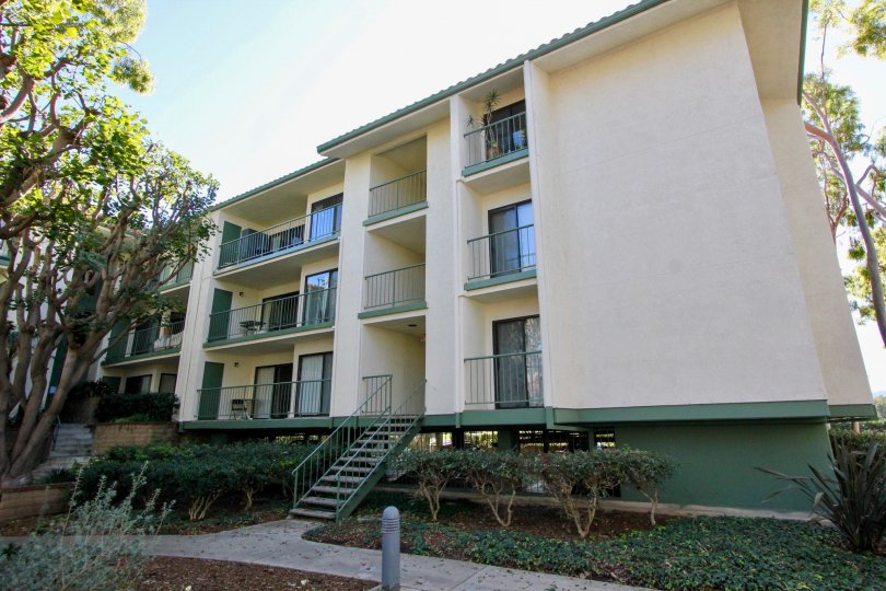A cream and dark green colored residential building