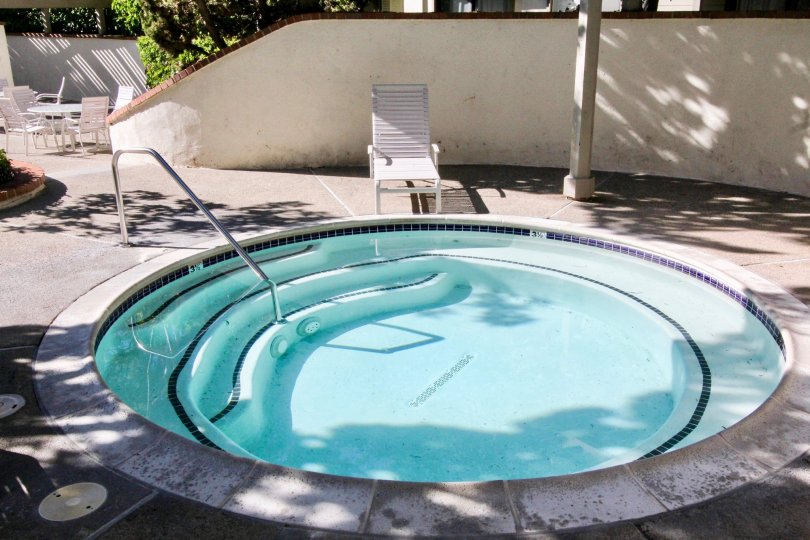 The Place in Rancho san Joaquin Townhomes has children's swimming Pool with one chair