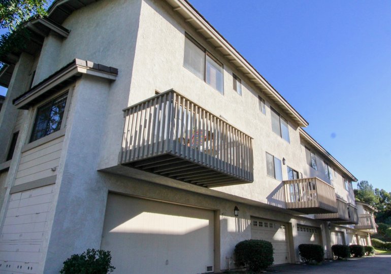 A row of parking garages at the base of housing inside Ridge Townhomes Bren in Irvine CA