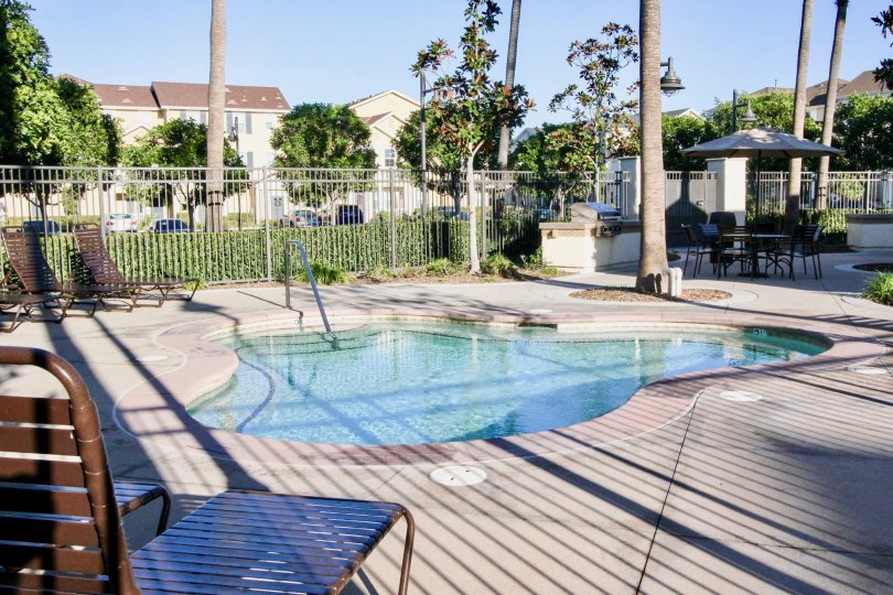 A pool with cement paving in the Savannah neighborhood.