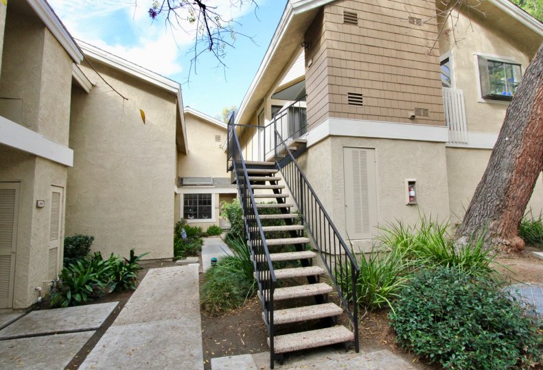 Attached iron and stone stairway leading up to housing at The Lakes in Irvine CA