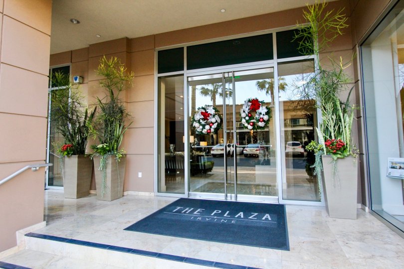 Holiday wreaths on the doors of the entry to The Plaza Irvine