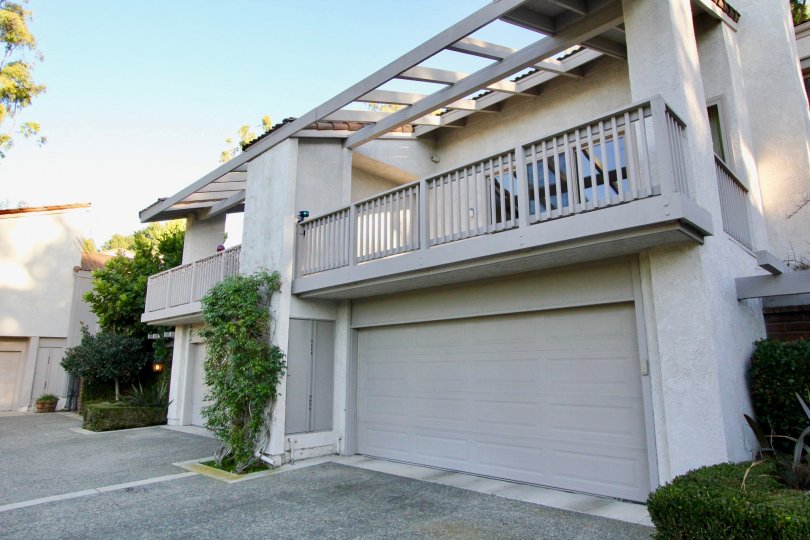 A view of the garage and balcony of a unit in Turtle Rock Vista on a sunny day