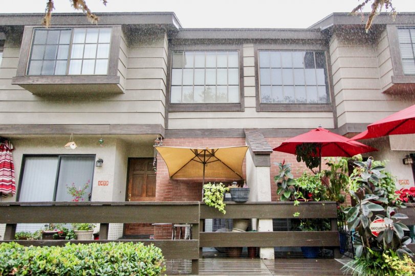 THIS IS THE FRONT VIEW WITH LOT OF CROTON PLANTS, UMBRELLA, GLASS WINDOWS ARE THERE IN LA HABRA CITY