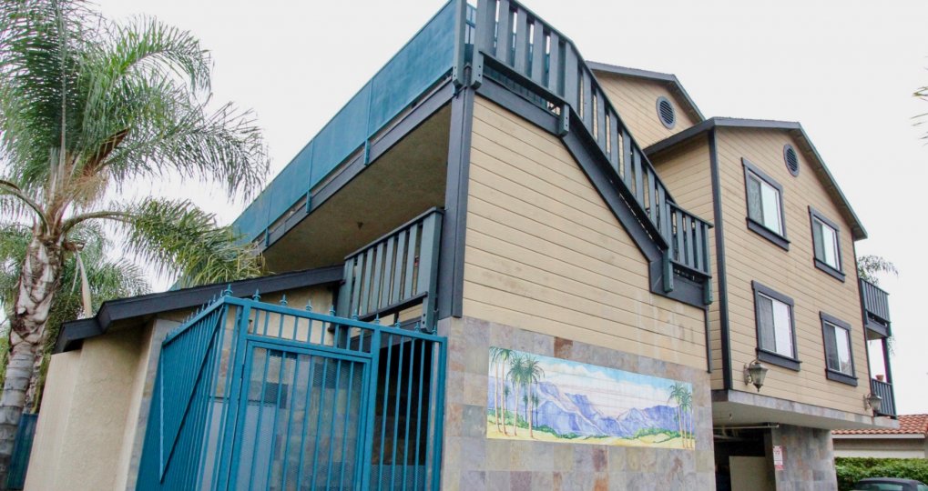 Art is painted at the wall of the Villa in Mountain View villas and with car is standing