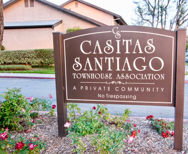 A sign for the Casitas Santiago Townhouse Association in Orange, California