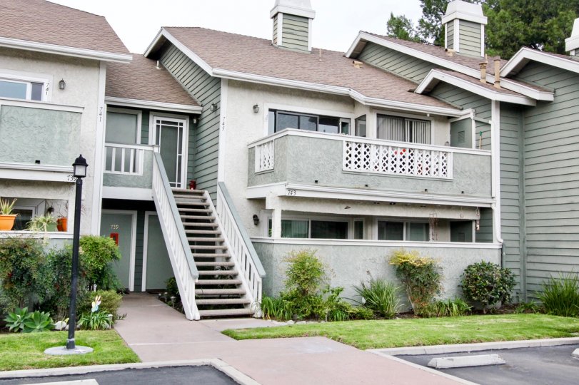 Beautiful neighborhood house with two stories and a lush green front yard