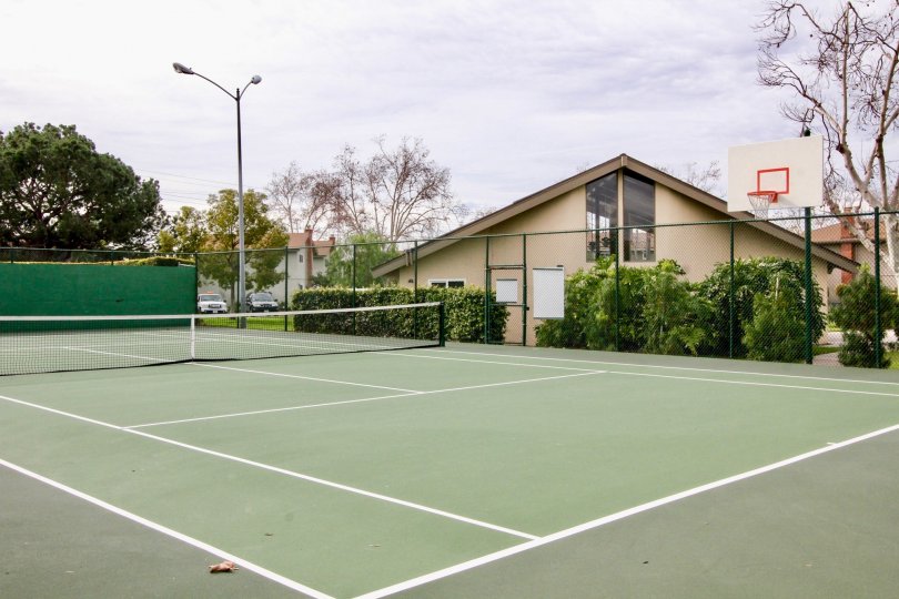 The tennis and basketball court in the Golden Circle community on a cloudy day