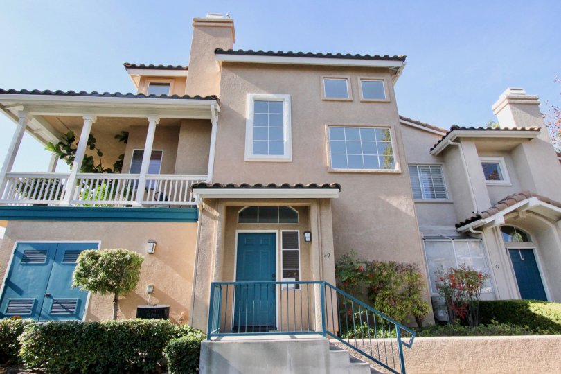 Majestic two story adobe styling with upstairs balcony at the Tierra Montanosa community