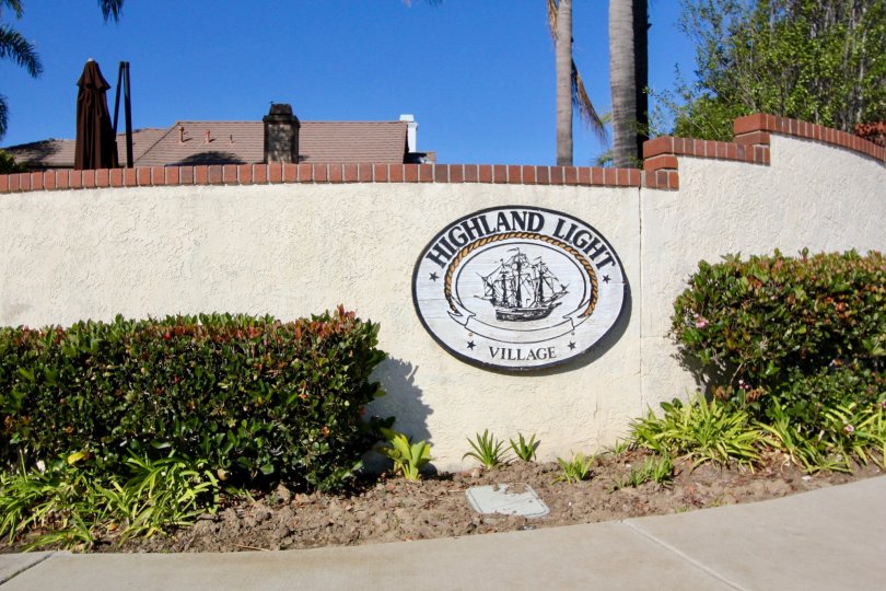 Highland Light Village, San Clemente, CA; Welcome Sign on cream wall with ship