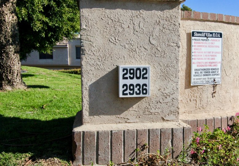 A two-unit number on a concrete column in Shore Cliff Villas.