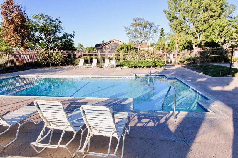 Chairs and pool at San Juan Hills in San Juan Capistrano, California