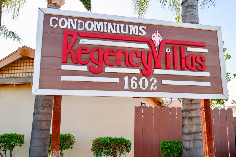 A large board showing the name of the Regency Villas community