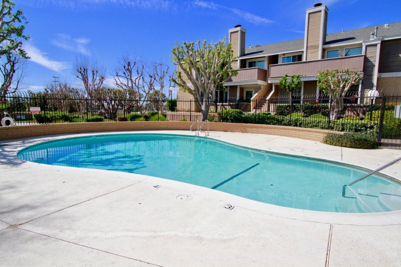 A lovely pool opposite a large bunglow with garden in the Santiago Springs community