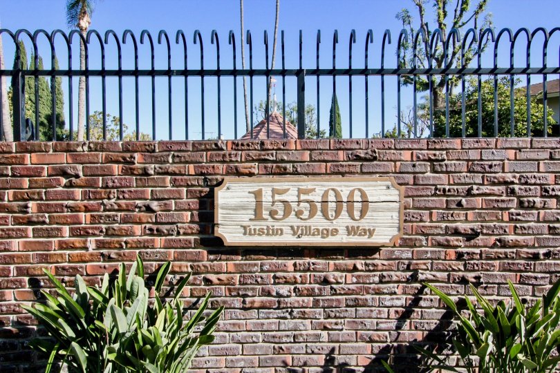 THE VILLAS IN THE TUSTIN VILLAGE WITH THE ADDRESS WALL, PLANTS, TREES