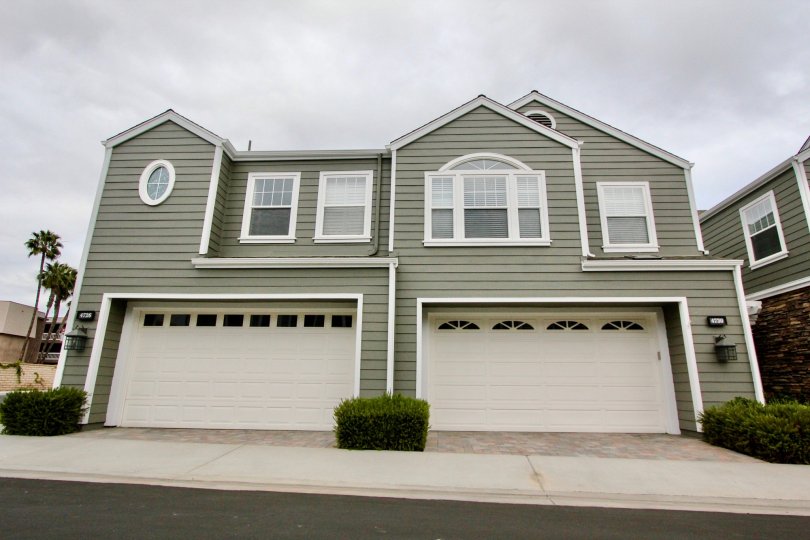 Two large gray Bayshore homes in Carlsbad California