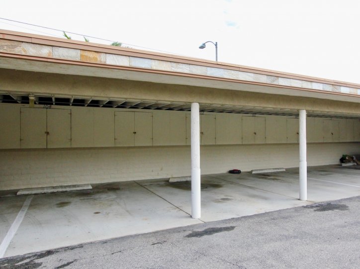 Empty parking spots in garage of Fontainebleu Terrace in Carlsbad, CA