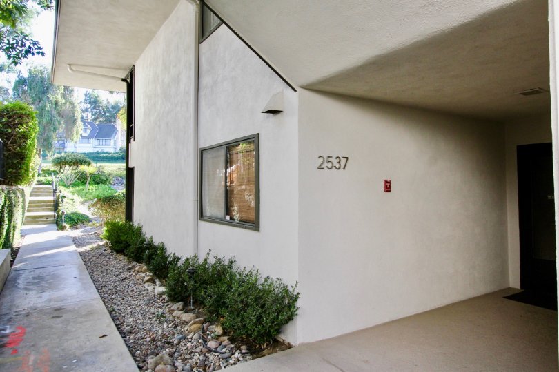 A bright day in the La Costa Fairways with a wall and number.