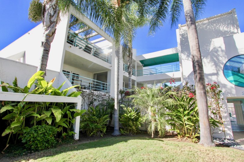 THE HOME IN THE LA COSTA GREENS WITH THE GRASSLAND, BANANA TREES, BALCONIS