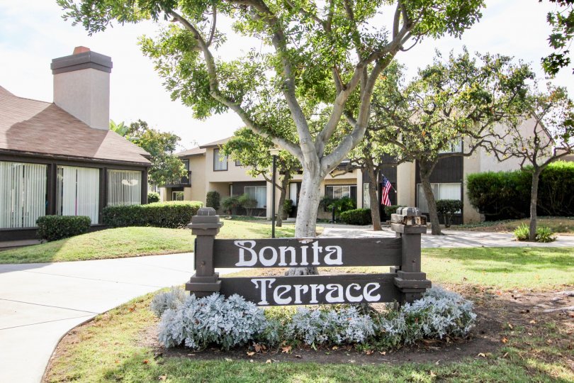 Bonita Terrance Entrance sign in front of a tree with walkway leading up to condos in Chula Vista, CA