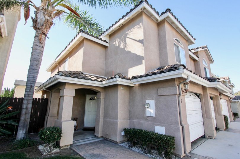 2 story duplex with garage and covered door entrance