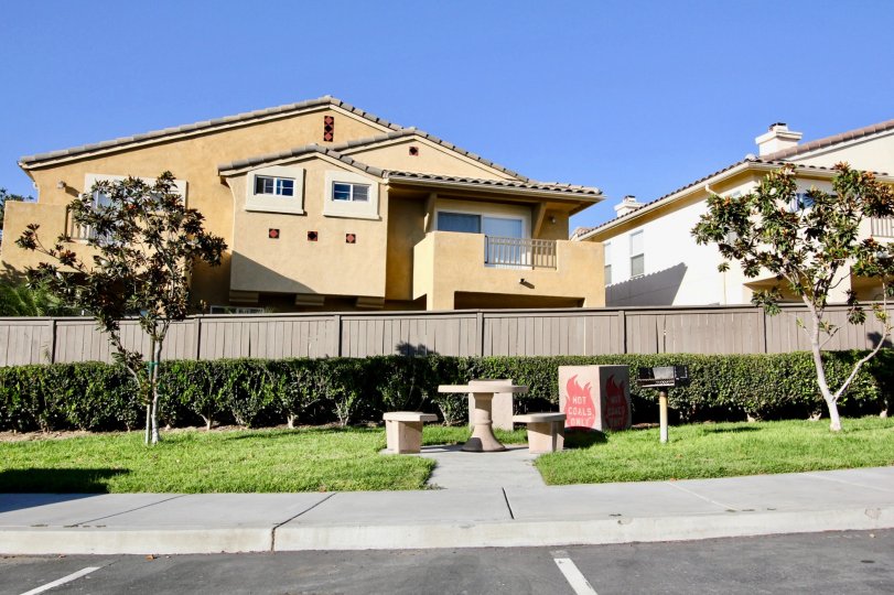 Sunny day walkway with chairs and table, Tivoli Villas Community, Chula Vista, CA