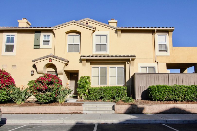 The front side of a villa at Chula Vista with lawn area in the front.