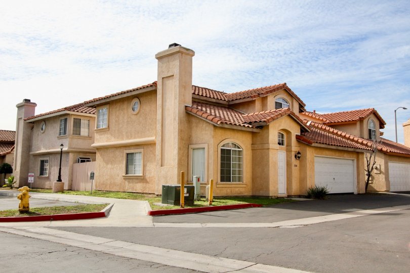 Lovely, yellow-colored single family house in Villa Rosa Community in California.