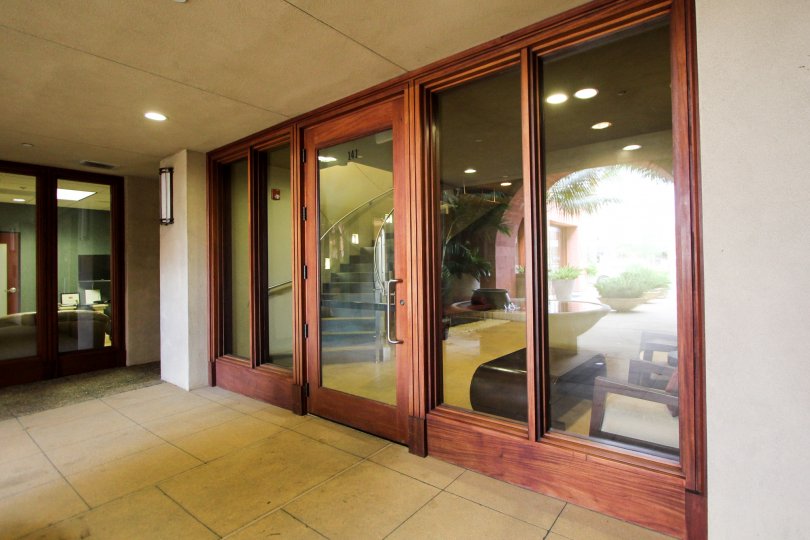 Wooden framed glass door entrance at Coronado City Views in Coronado California