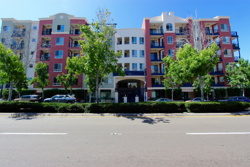 Row of cars parked below a street of condo high rises at 235 Market in Downtown San Diego CA