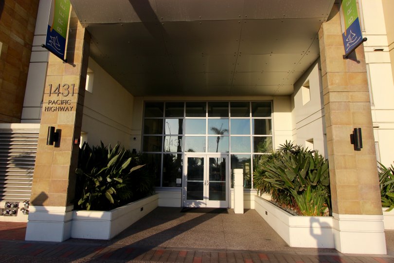 Two stone columns sit near the door to the main entrance at the Breeza condos