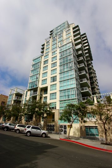 No vehicles are parked at the red curb in front of Discover condos.