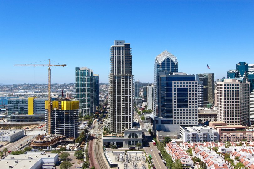 A view of the skyline of the Electra community including condos, high rise offie buildings, and a crane.