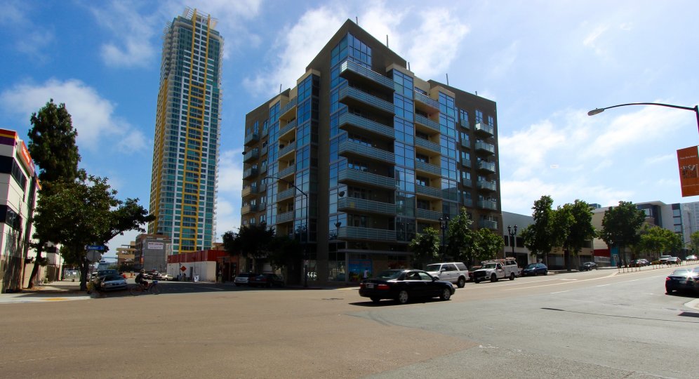 A street view of a glass building in Element community in Downtown San Diego CA.
