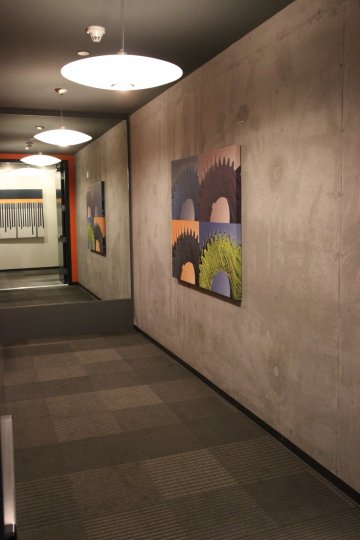 Two similar painting hand on a wall at Fahrenheit in Downtown San Diego.