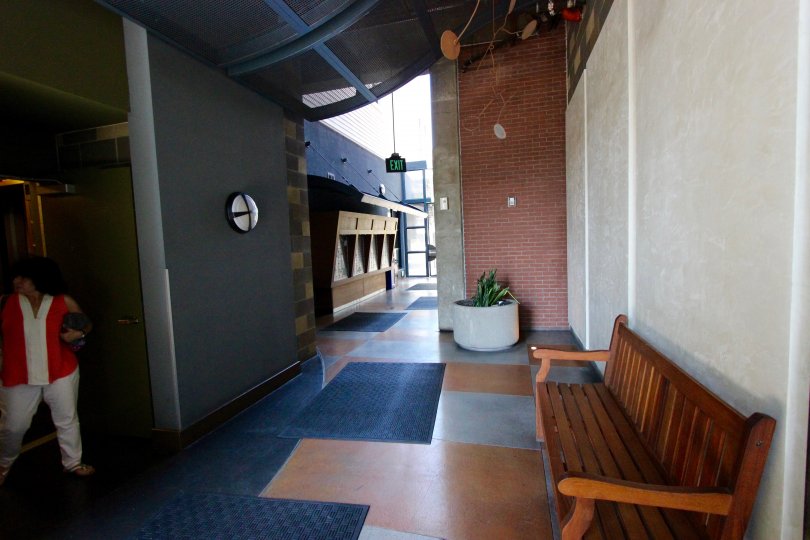 A cool and calming view of the interiors at The Lofts @ 777 Sixth with seating places and tasteful fixtures and muted colors on the walls