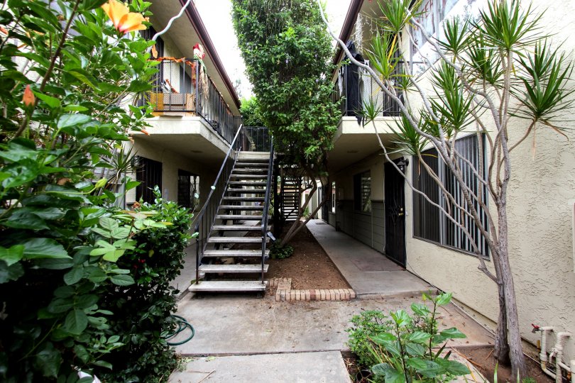 VERY BEAUTIFUL HOUSE. IN FRONT OF IT THERE IS A LAWN. GREENERY IS EVERY WHERE.
