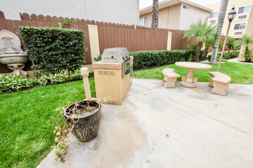 table, bench, grill, patio, fence, house, home, palm tree