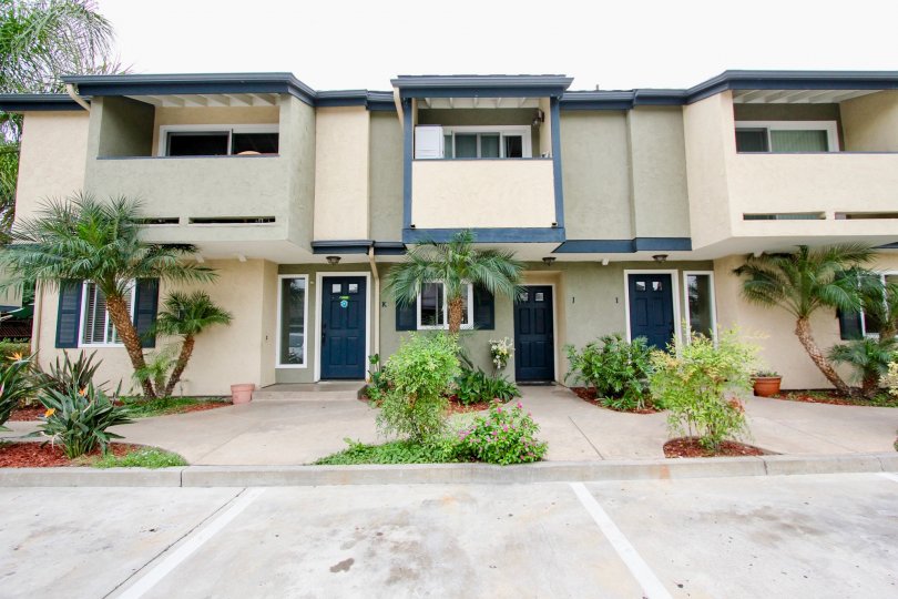 The Magnolia Park Townhomes looks very wide with beautiful plants in the front side
