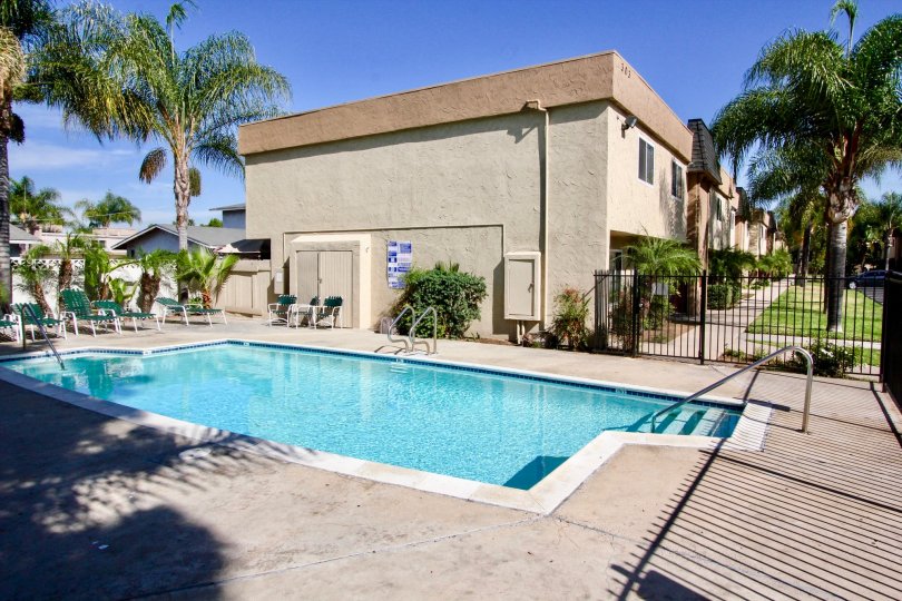A BEAUTIFUL SWIMMING POOL WITH FULL OF WATER IN A VILLA