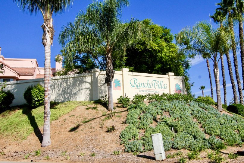 Community sign surrounded by palm trees at Rancho Villas in El Cajon Caliofrnia
