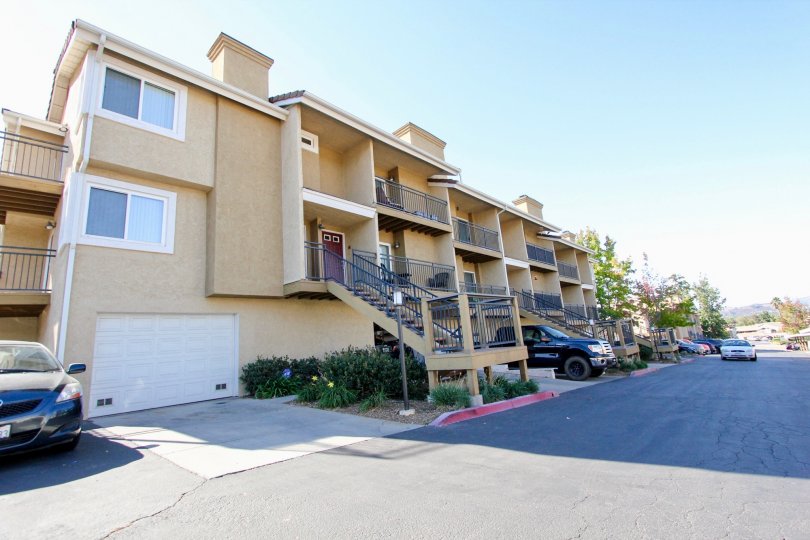 Three story residential units near driveway at The Heritage in Escondido California
