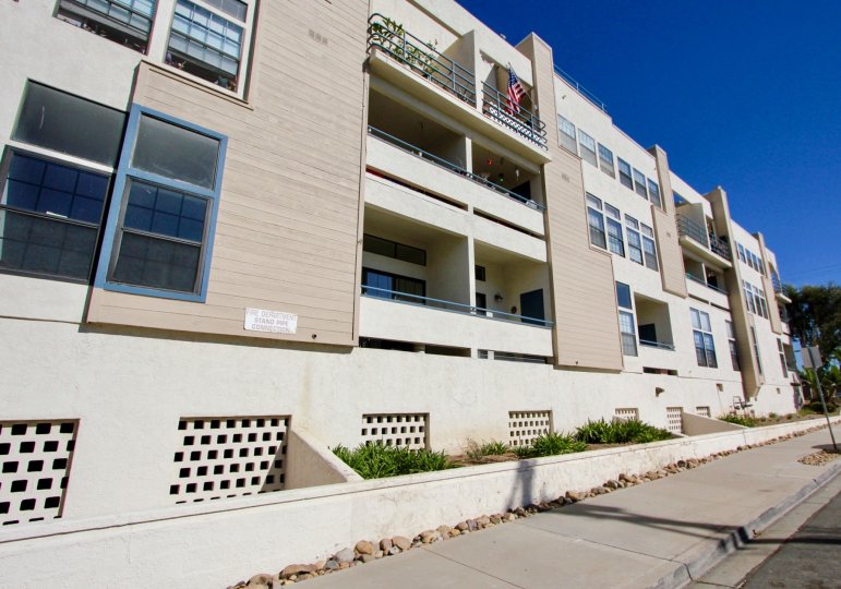 Three story residential units near street at Summer Sea in Imperial Beach California