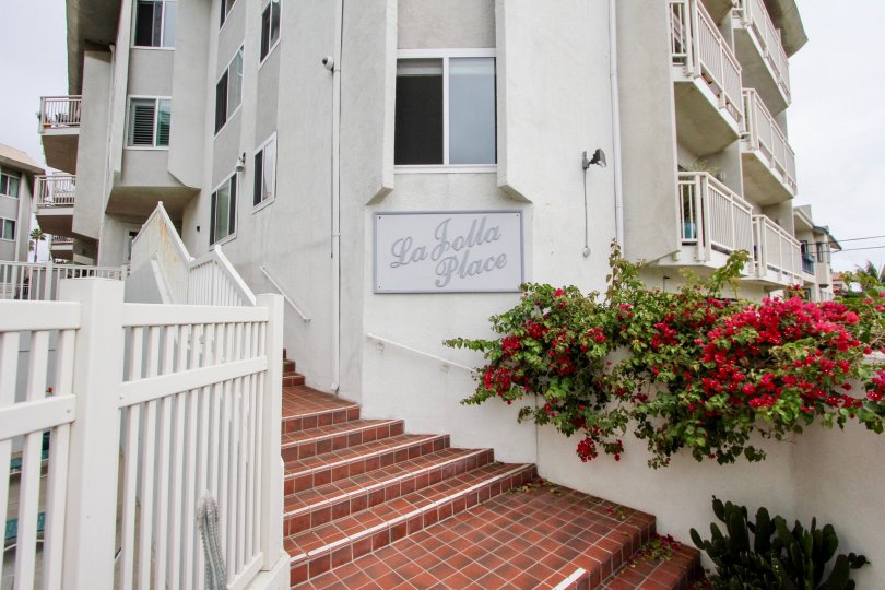 Gray sign next to a spiral stair case in La Jolla Chelsea in La jolla CA