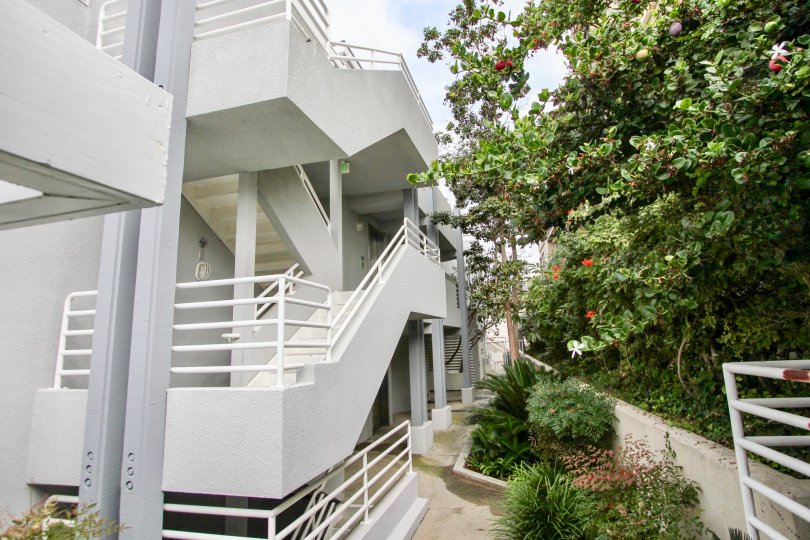 A large stairwell that is white and wide located in LJ Windigo community.