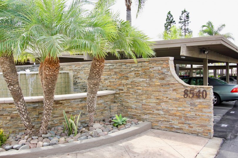 A large entrance showing number made with stones in Villa La Jolla community.