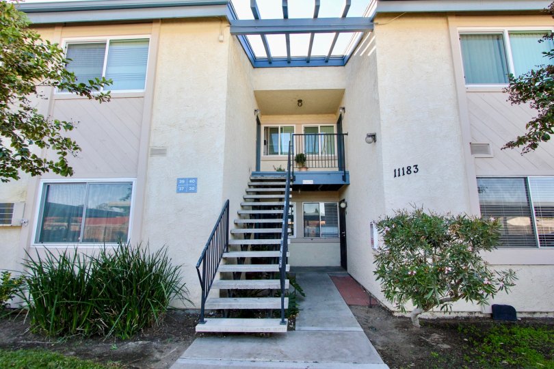 Two story residential building with attached stairway at Villa Mar in Mira Mesa California