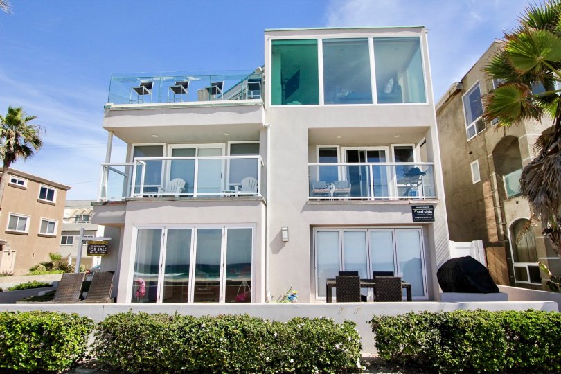 A property with large glass windows to let in natural lighting, and a viewing area at Ocean Front One